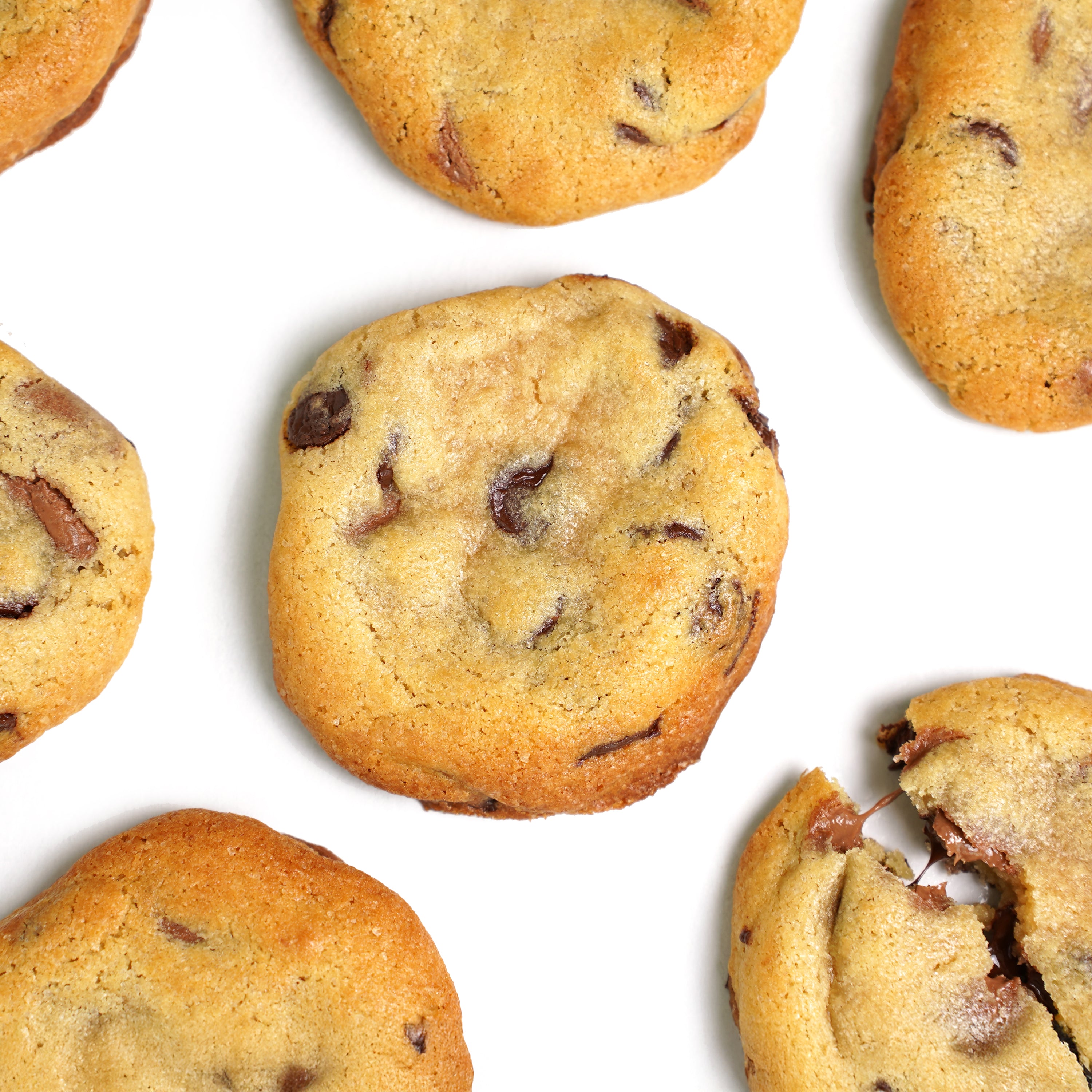 'Freshly baked chocolate chunk cookies on parchment paper'
